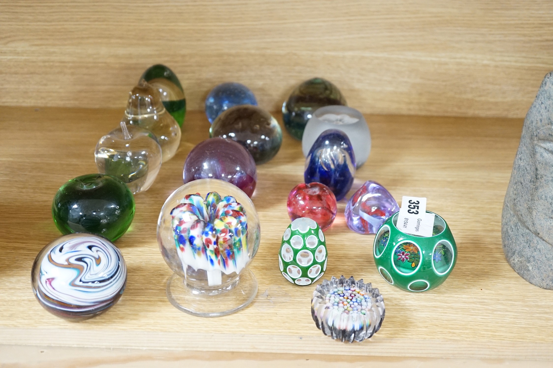A collection of mixed paperweights to include a faceted floral Perthshire example, other Scottish floral and millefiori examples (Qty), tallest 12cms high